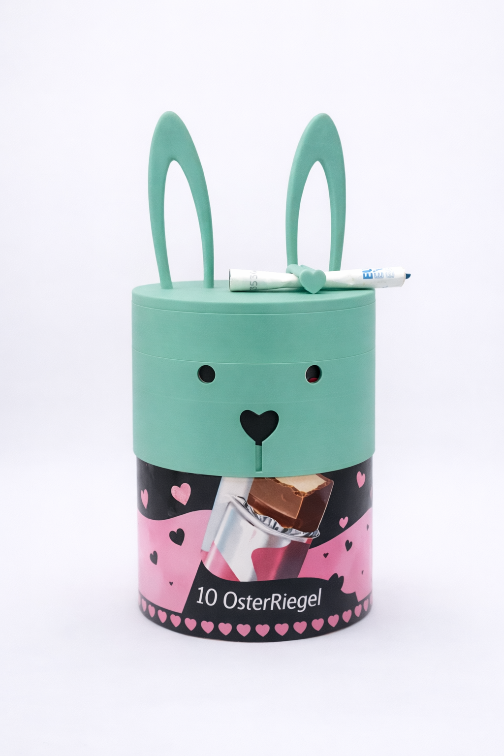 ChocoMask Bunny Schokoriegel Geschenk zu Ostern in Mint – moderner Osterhase mit Herzmotiv als kreative Verpackung für Schokoriegel oder kleine Überraschungen von MUDIVO.