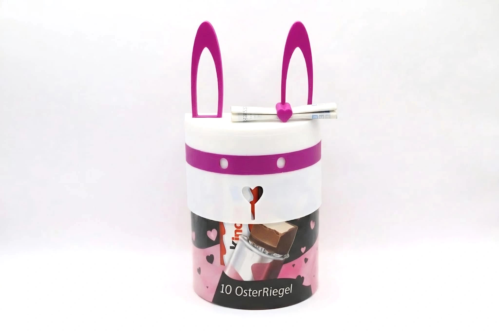 ChocoMask Bunny Schokoriegel Geschenk zu Ostern in Weiß und Fuchsia – verspielte Osterbox mit Hasenohren für Schokolade oder Geldgeschenke.