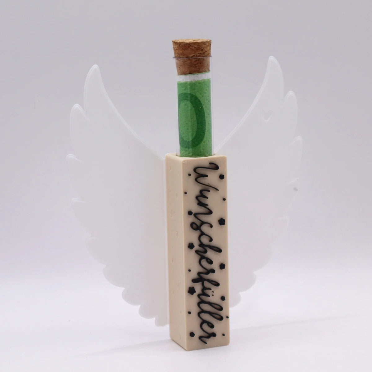 Mudivo WishYouXmas – Aufsteller mit weißen Flügeln, schwarzer Schrift und beigem Körper. Reagenzglas eingesteckt – edles Geldgeschenk mit Weihnachtszauber. ✨