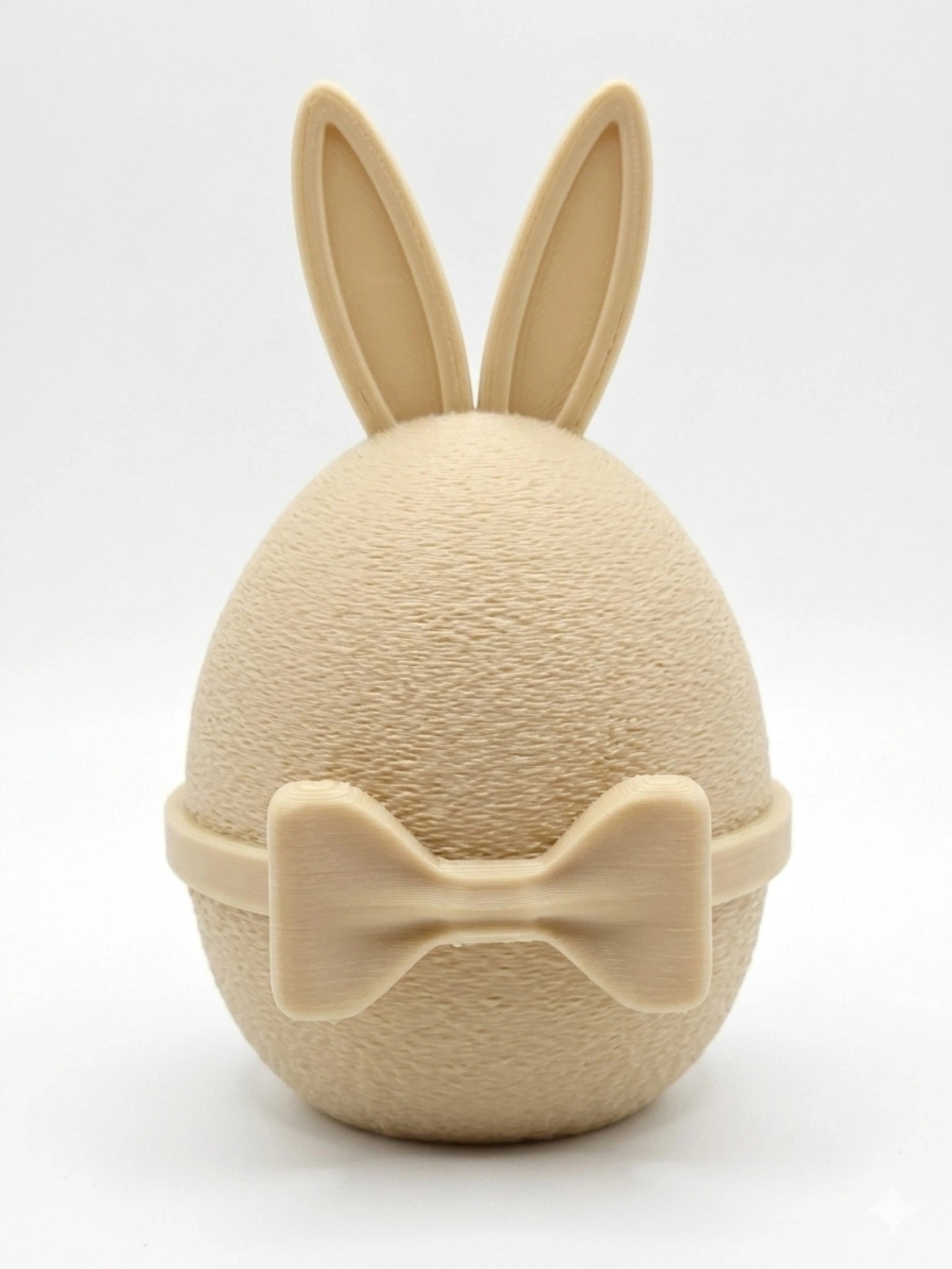 GentleEgg Design-Osterei mit Hasenohren und Fliege in Beige – stilvolles Oster-Dekoelement aus 3D-Druck von MUDIVO