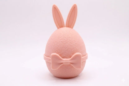 GentleEgg Design-Osterei mit Hasenohren und Fliege in Peach Pink – minimalistisches Dekoelement aus 3D-Druck von MUDIVO