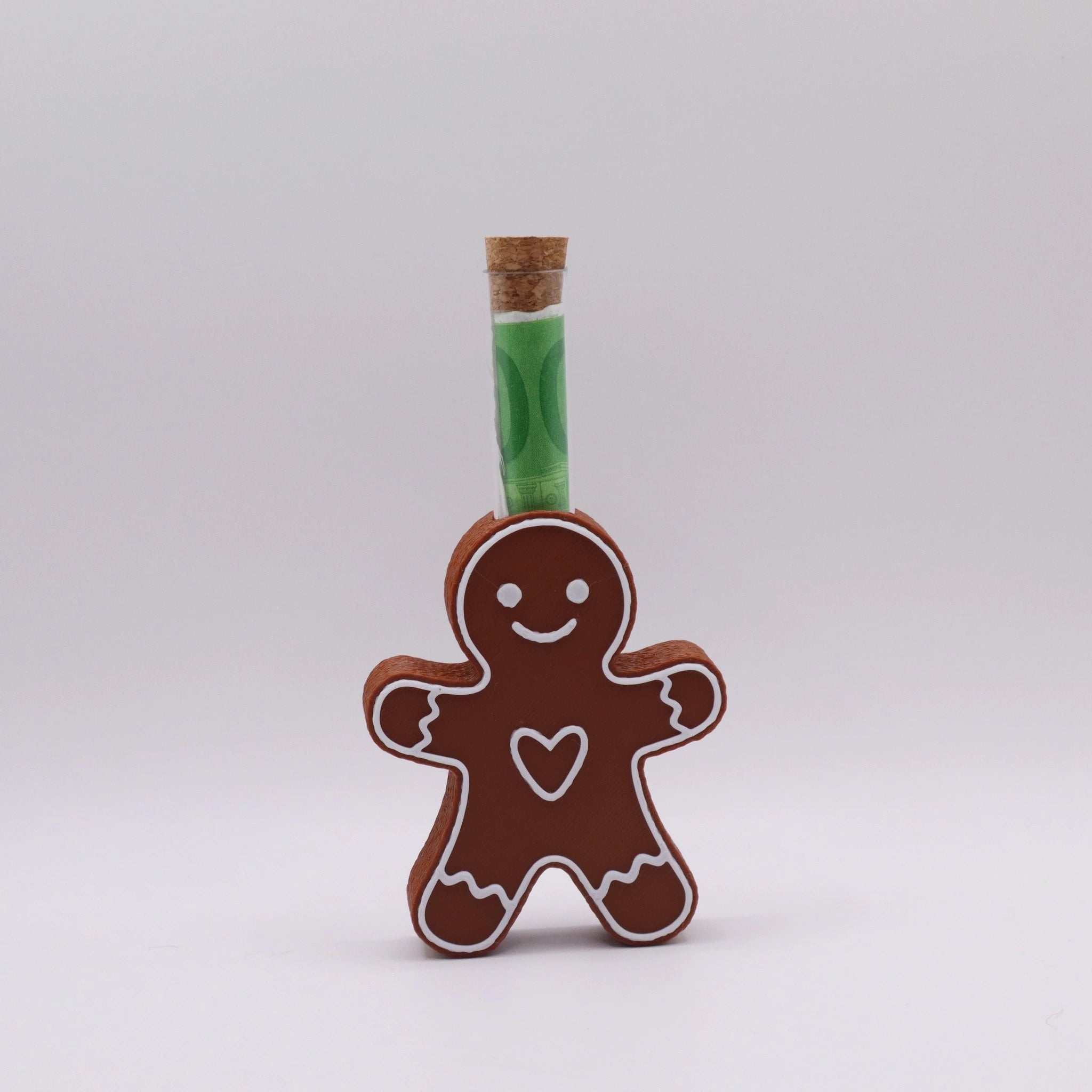 Lebkuchenfigur GingerHug mit offenen Armen und Reagenzglas – kreatives Weihnachts-Geldgeschenk aus 3D-Druck von Mudivo.