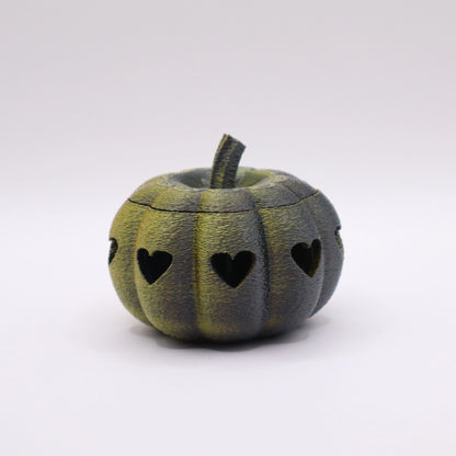 3D-gedruckter Heart o’-Lantern Kürbis in schwarz und gold mit Herz-Ausschnitten und Glow-Effekt
